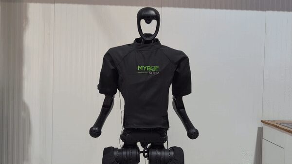 Unitree H1 humanoid fitted with a MYBOTSHOP-branded protective suit, arms in the default position