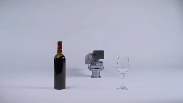 Unitree Z1 gripper positioned between a wine bottle and glass, from the Z1 Manuals documentation page